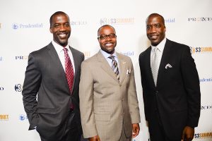 Three men in suits and ties posing for a picture.